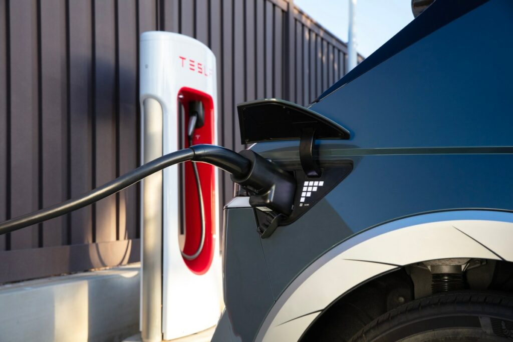 Hyundai charging at a Tesla station