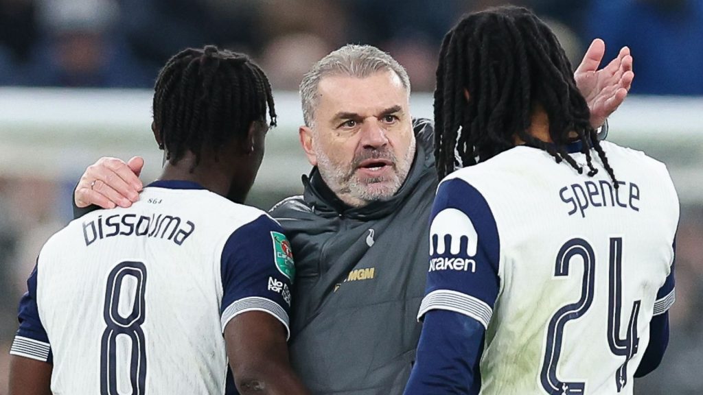 Ange Postecoglou, manager of Tottenham Hotspur, celebrates with Yves Bissouma and Djed Spence