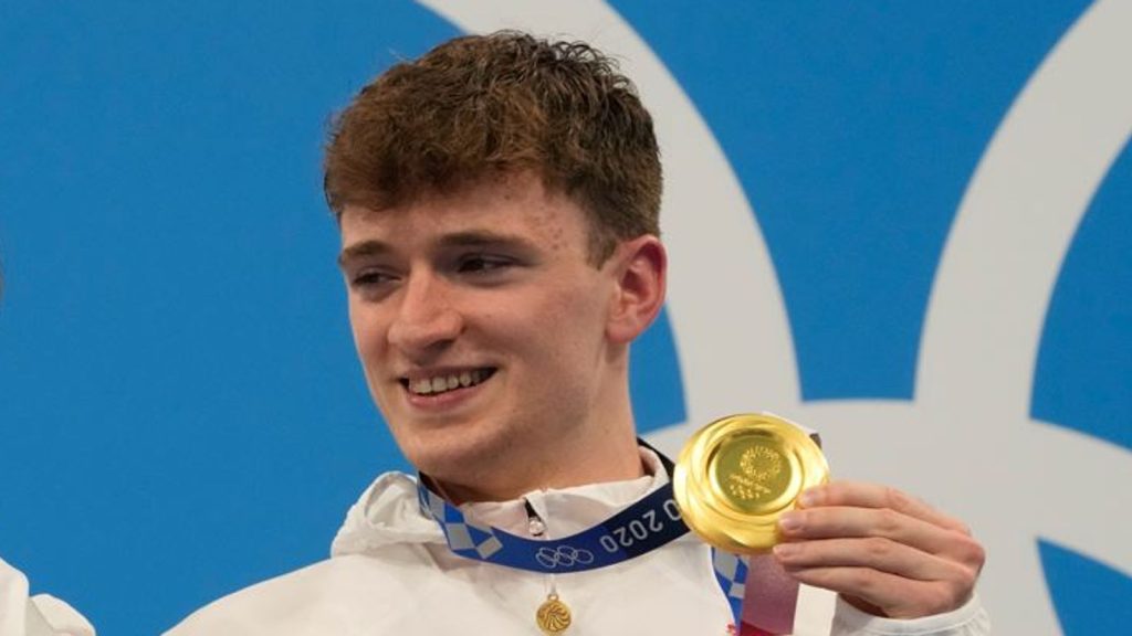 Matty Lee celebrates his Olympic gold for Team GB at the 2020 Tokyo Games