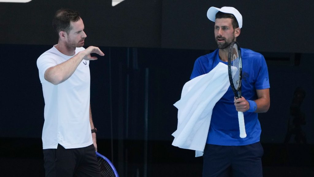 Serbia's Novak Djokovic talks with his coach Andy Murray, left, during a practice session ahead of the Australian Open tennis championship in Melbourne, Australia, Thursday, Jan. 9, 2025. (AP Photo/Mark Baker)