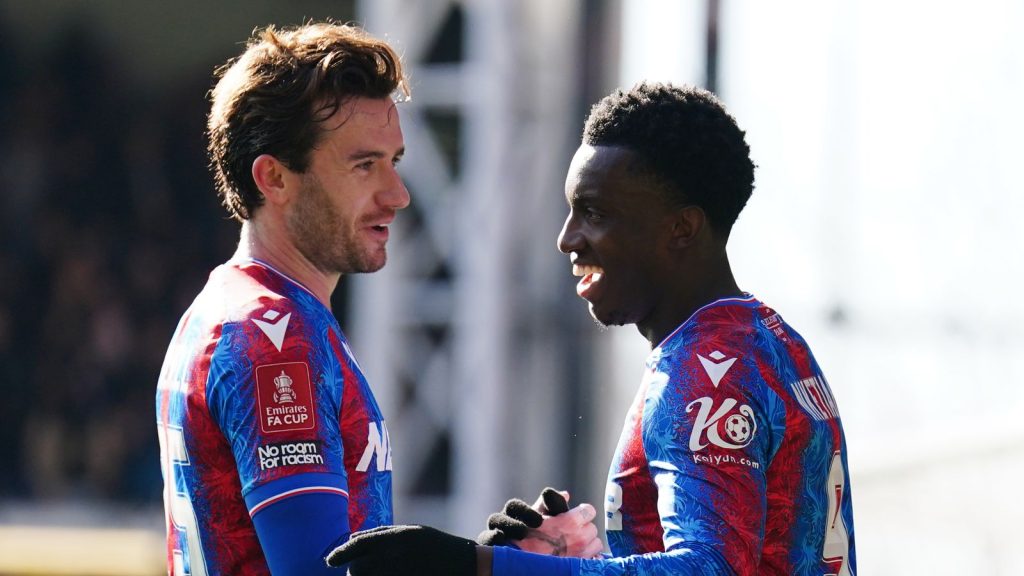 Eddie Nketiah (R) celebrates his goal against 10-player Millwall